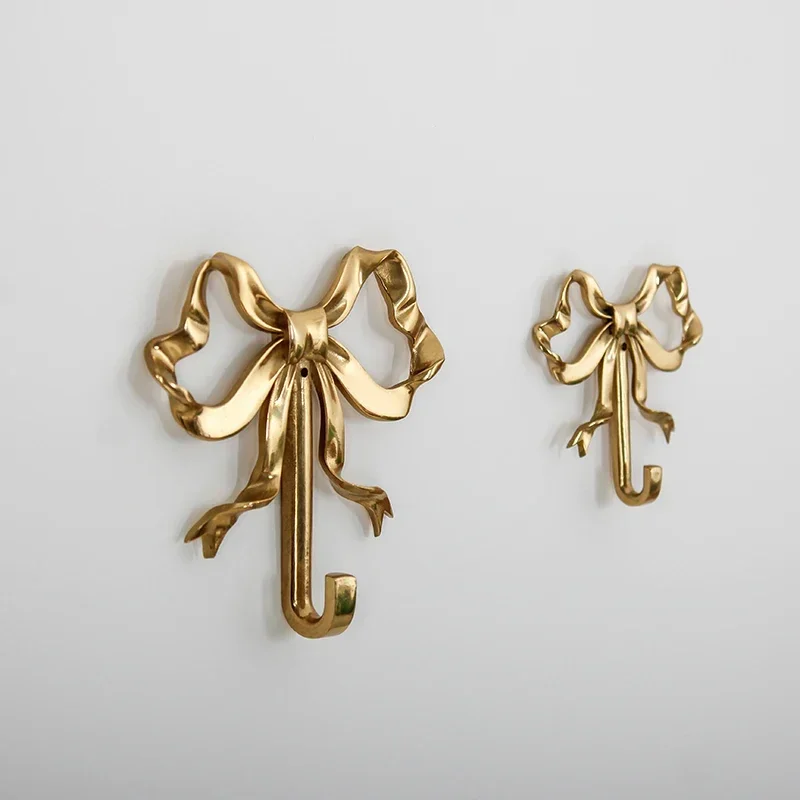 خطاف حائط فاخر على شكل قوس مصن - مراجعة Antique Brass Hook وسعره